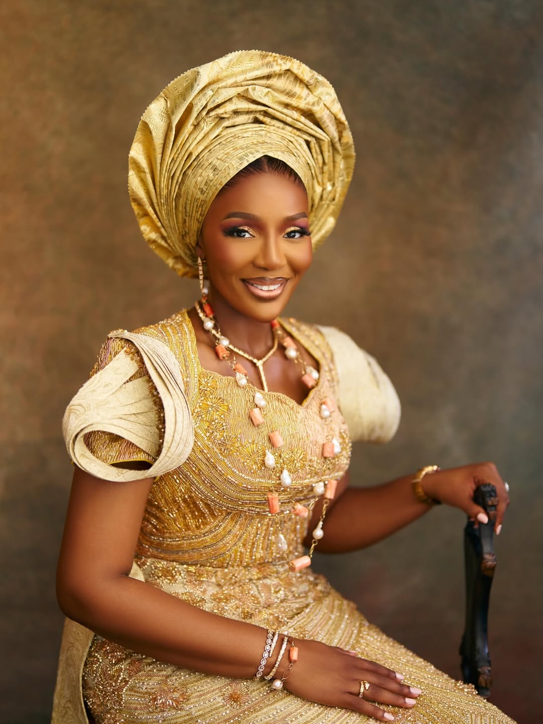 Her Majesty Olori Atuwatse III smiling in gold