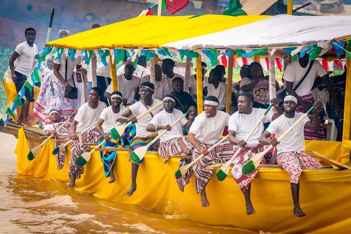 Decorated regatta boats beneath colourful flags