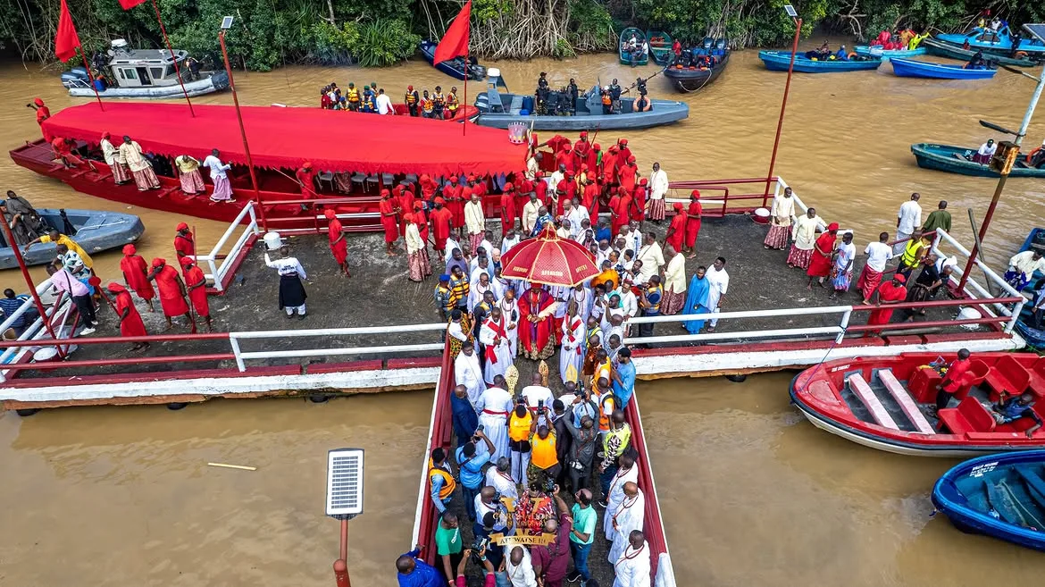 Ceremonial horn bearer aboard the royal boat